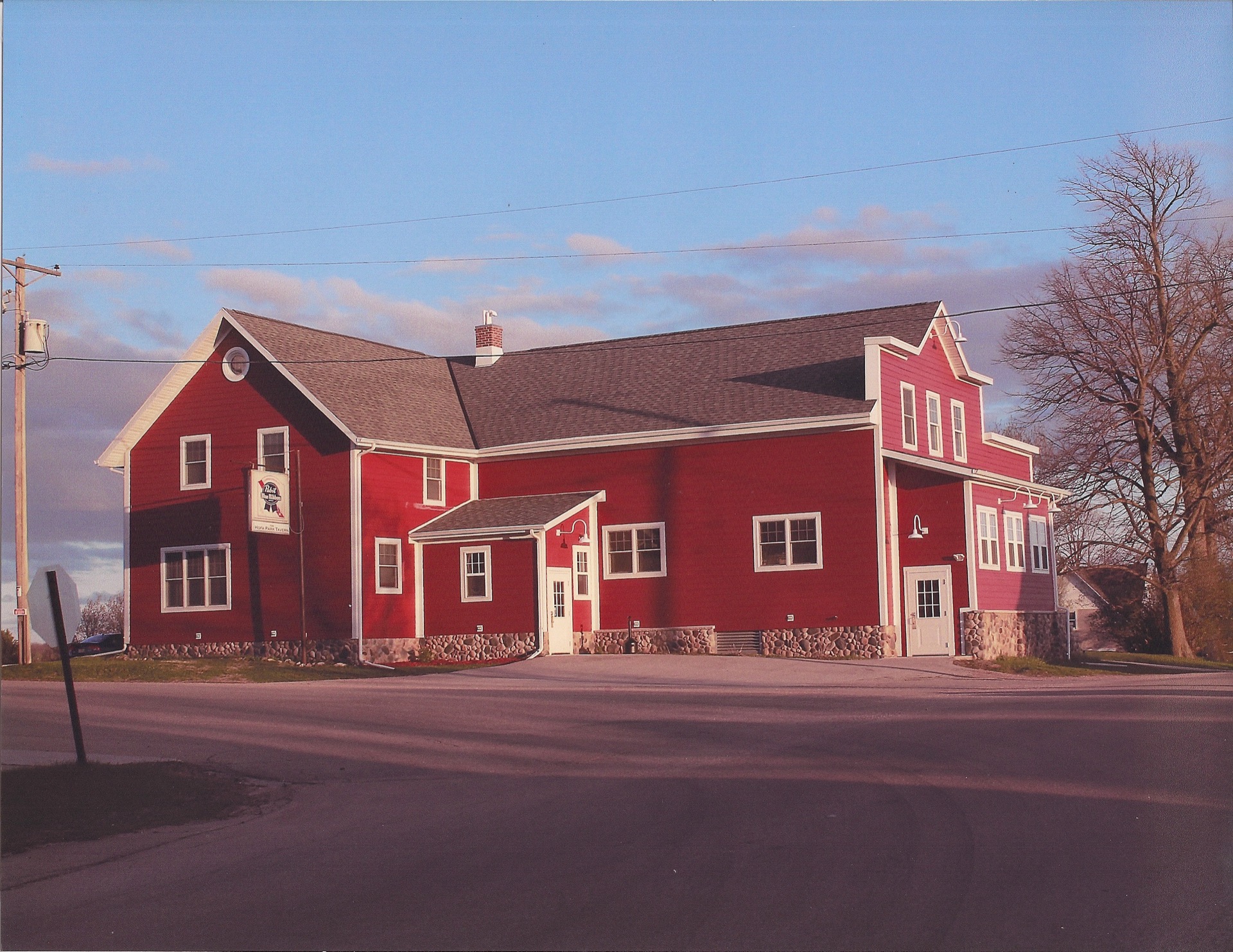 The red Hofa Park Tavern building on a sunny day